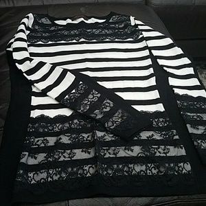 Like new. Only worn once. Beautiful top. Lace trim